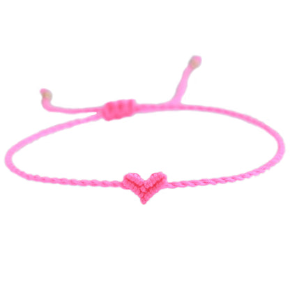 Armband mit geflochtenem Herz in pink von Love Ibiza. 