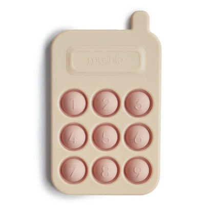 Press Toy "Smartphone" in blush von Mushie - Produktabbildung