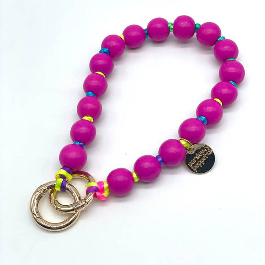 Stylische Handykette mit Holzperlen in den sommerlichen Farben pink & buntem Band. 