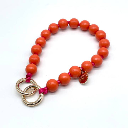 Stylische Handykette mit Holzperlen in den sommerlichen Farben rot und pink. 