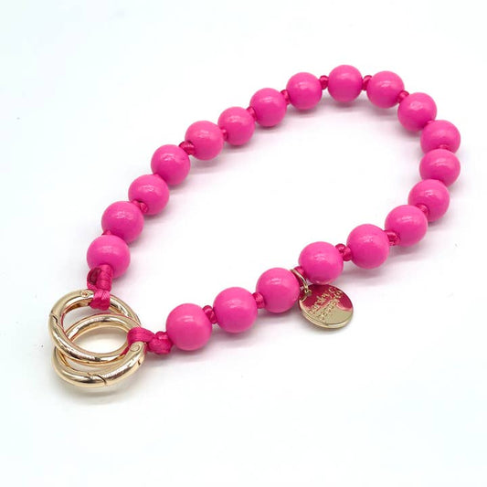 Stylische Handykette mit Holzperlen in pink. 